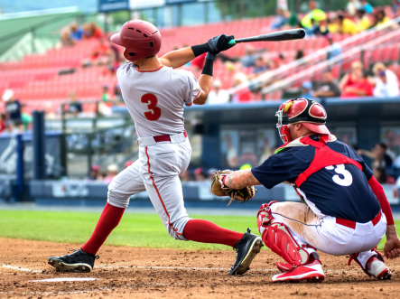 Young baseball players on field